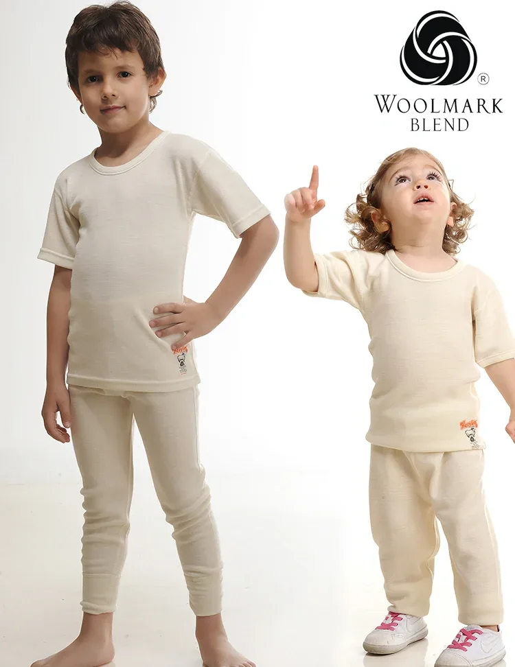 550%20-%20Children%27s%20Long%20Wool%20Underwear%20-%20550 Soft beige woolmark blend children's loungewear set featuring a T-shirt and sweatpants, designed for comfort and style. Perfect for casual wear or relaxing at home. High-quality material ensures durability and warmth.