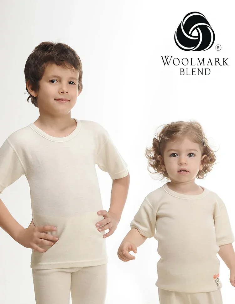 500%20-%20Children%27s%20Short%20Sleeve%20Wool%20Undershirt%20-%20500 Plain cream-colored children's loungewear set, cozy and stylish for kids, perfect for comfortable home wear or casual outings, made from soft woolmark blend fabric for quality and durability.
