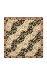 Vivid floral patterned Turkish rug with black, beige, and orange motifs, showcasing traditional craftsmanship and intricate details for elegant home decor.