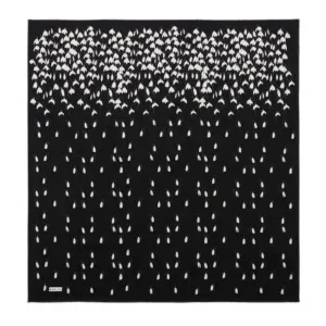 A beautiful black and white patterned scarf with an intricate floral and geometric design, perfect for stylish accessories or home decor.