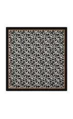 Elegant black and white geometric patterned scarf with a stylish border, perfect for fashion-forward accessories and versatile styling options.