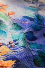 Vibrant colorful abstract leaf pattern fabric designed for home decor or fashion accessories.