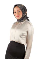 Elegant woman wearing a silk blouse and a floral patterned satin hijab, representing Turkish fashion and style from Shop of Turkey.