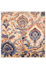 Elegant Turkish floral rug with intricate blue, orange, and off-white patterns, showcasing traditional craftsmanship and vibrant design elements.