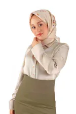 Silk beige hijab with floral embroidery worn by a woman in a professional beige blouse and olive skirt, showcasing modest fashion from Turkey, perfect for stylish and elegant outfits.