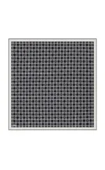 Intricate black and white lattice pattern mat with geometric design, perfect for home decor, entrances, or outdoor spaces, combining style and durability.