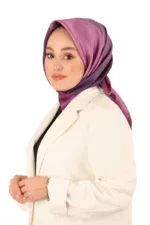 Elegant woman wearing a stylish purple and pink gradient hijab and a chic cream blazer, showcasing modern modest fashion from Turkey.