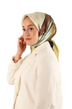 Luxurious woman wearing a silk patterned hijab and elegant cream blazer, showcasing modern fashion from Turkey, perfect for stylish accessories and clothing shopping.