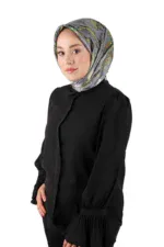 Elegant woman wearing a colorful silk headscarf and black blouse, showcasing Turkish fashion accessories. Perfect for stylish, modest looks or cultural attire, available for quick shipping at Shop of Turkey.
