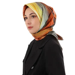 Vibrant multicolored silk headscarf styled elegantly on a woman wearing a black blazer, showcasing Turkish fashion and textile craftsmanship.