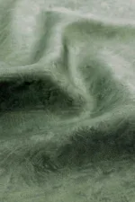 Luxurious olive green silk fabric with soft texture and subtle sheen, perfect for elegant clothing and accessories.