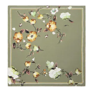 Vivid floral patterned area rug with large yellow, white, and green blossoms on a muted olive-green background, perfect for home decor or gifting from Turkey.