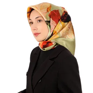 Elegant woman wearing a colorful floral silk hijab and a black blazer, showcasing stylish modest fashion; perfect for shop of Turkey online shopping.
