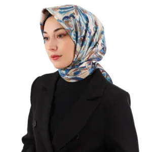 Elegant woman wearing a stylish patterned silk headscarf paired with a black blazer, showcasing Turkish fashion and accessories at Shop of Turkey for quick worldwide shipping.