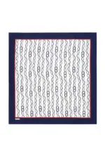 Shawl with geometric pattern of interconnected loops and squares, featuring a stylish navy, white, and red border, perfect for adding elegance to any outfit.