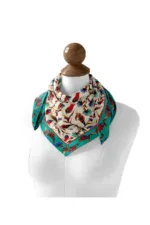 Vibrant floral silk scarf with intricate patterns, draped elegantly on a mannequin bust. Perfect for adding a touch of Turkish style to any outfit. Buy now from Turkey with fast shipping via Shop of Turkey.