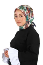 Elegant woman wearing a colorful paisley-patterned headscarf and a stylish black outfit, showcasing Turkish fashion and traditional accessories from Turkey. Perfect for stylish, cultural, and fashion-forward looks.