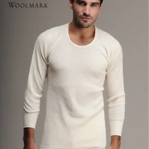 Soft cream wool sweater on male model, Woolmark certified clothing for men, stylish and comfortable winter fashion.