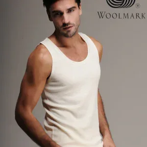 Woolmark logo on gray background, male model wearing white sleeveless top, fashion clothing, men's casual wear, high-quality fabric, stylish comfort, apparel branding, modern menswear, wool clothing, shopping in Turkey.