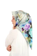 Luxurious floral print silk hijab with vibrant watercolor design, perfect for elegant modest fashion. Buy from Turkey with fast shipping at Shop of Turkey.
