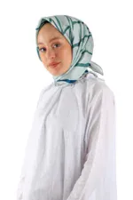 Luxurious silk hijab with modern abstract design in shades of blue and white, perfect for stylish modest fashion.