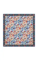 Handmade Turkish floral patterned wool rug featuring vibrant red, blue, and beige colors, ideal for adding traditional charm to any living space. Perfect for home decor enthusiasts seeking authentic Turkish craftsmanship.