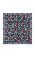 Vibrant Turkish floral patterned textile with intricate red, blue, and white designs on a dark background, showcasing traditional craftsmanship.