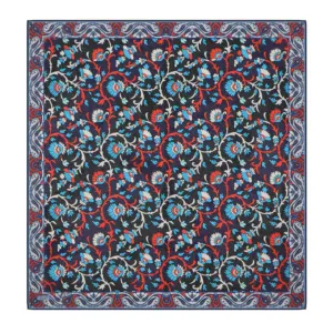 Vibrant Turkish floral patterned textile with intricate red, blue, and white designs on a dark background, showcasing traditional craftsmanship.