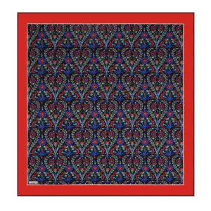 Vibrant floral patterned textile with intricate red, blue, and light-colored motifs on a dark background, framed by a bold red border, showcasing traditional Turkish design elements.