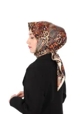 Elegant woman wearing stylish leopard print and striped silk headscarf, showcasing Turkish fashion accessories from Shop of Turkey, perfect for sophisticated and fashionable looks.