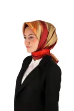 Elegant woman wearing a colorful silk hijab and black business suit, representing modern Turkish fashion and style. Perfect for shopping from Turkey with fast shipping options.