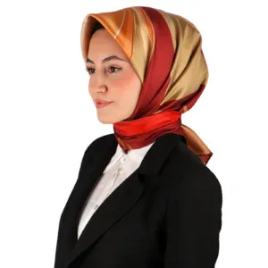 Elegant woman wearing a colorful silk hijab and black business suit, representing modern Turkish fashion and style. Perfect for shopping from Turkey with fast shipping options.