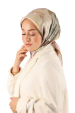 Elegant woman wearing a silk hijab and cream-colored blazer, showcasing modest fashion from Turkey, available for purchase with fast shipping on Shop of Turkey.
