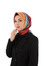 Colorful silk headscarf worn by a woman in a black blazer, showcasing Turkish fashion and cultural elegance. Perfect for stylish accessories and vibrant ethnic look.