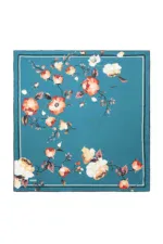 Vibrant turquoise floral area rug with orange, cream, and purple blossoms and delicate leaves, perfect for adding elegance and color to living rooms, bedrooms, or dining areas.