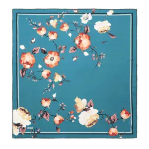 Vibrant turquoise floral area rug with orange, cream, and purple blossoms and delicate leaves, perfect for adding elegance and color to living rooms, bedrooms, or dining areas.