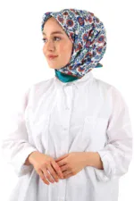 Turkish floral patterned silk headscarf on a woman wearing a white chef coat, showcasing traditional Turkish textiles in fashion.