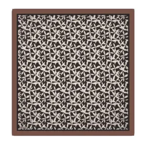 Intricate black and white geometric patterned textile with a brown border, showcasing traditional Turkish design, perfect for home decor or cultural collection.