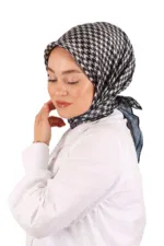 Houndstooth patterned hijab, woman in white blouse, modest fashion, Turkish headscarf, stylish Islamic wear.