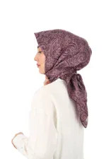 Elegant woman wearing a purple patterned silk headscarf styled with a classic white blouse, showcasing Turkish textile craftsmanship and vibrant fashion accessories from Turkey.