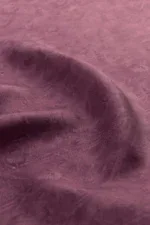 Luxurious purple velvet fabric with a soft, smooth texture and subtle sheen, perfect for clothing, upholstery, or craft projects, showcasing high-quality material from Turkey.