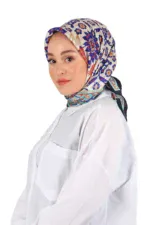 Vibrant floral patterned silk headscarf in shades of blue, red, and beige worn by a woman with a white blouse, showcasing Turkish fashion and cultural style.