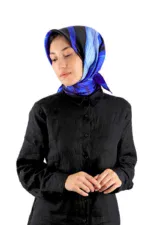 Stylish woman wearing a beautiful blue and black silk hijab, dressed in a black button-up shirt, showcasing Turkish fashion and accessories for online shopping.