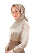 Elegant woman wearing a beige satin blouse and stylish patterned hijab, showcasing modest fashion and accessories for women, available for fast shipping from Turkey.