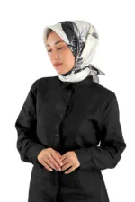 Elegant woman wearing a stylish black button-up shirt and a white silk scarf with black floral patterns, showcasing Turkish fashion and accessories from Shop of Turkey for a sophisticated look.