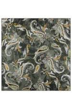 Paisley patterned fabric with intricate floral and swirling designs in white, gold, and light blue on a dark green background, ideal for clothing or home decor.