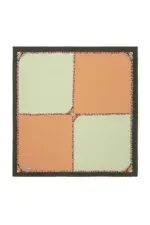 Colorful Turkish coffee filters with orange and green patterns in a black frame, perfect for brewing traditional Turkish coffee quickly and easily. Ideal for coffee lovers seeking authentic taste.