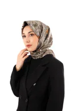 Elegant woman wearing a stylish patterned silk hijab and black blazer, promoting high-quality Turkish fashion accessories from Shop of Turkey with fast shipping.