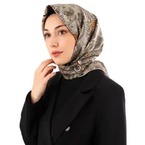 Elegant woman wearing a stylish patterned silk hijab and black blazer, promoting high-quality Turkish fashion accessories from Shop of Turkey with fast shipping.