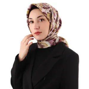 Luxurious silk-patterned hijab styled by a stylish woman, showcasing elegant fashion accessories. Perfect for modern women seeking sophisticated and beautiful headscarves.